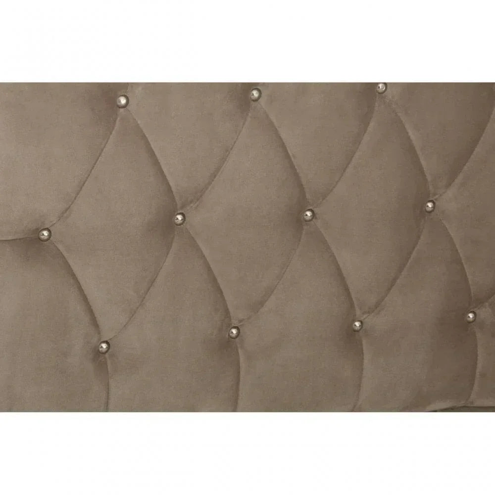 Taupe velvet bed headboard with diamond button tufting and metallic stud accents