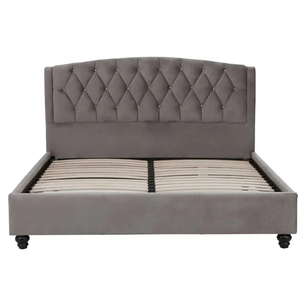 Grey velvet upholstered bed frame with diamond tufted headboard and wooden slats