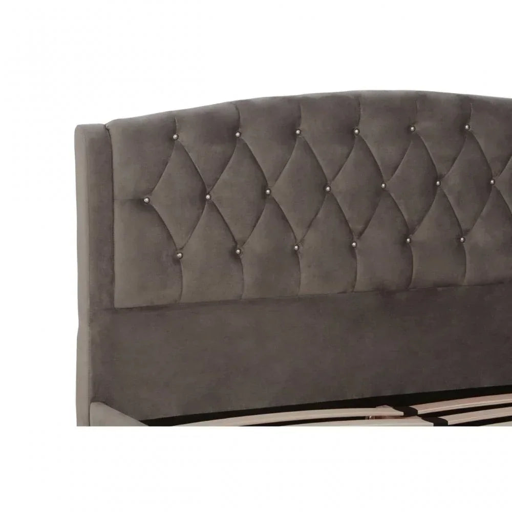 Grey fabric bed frame with diamond tufted headboard and crystal button detailing