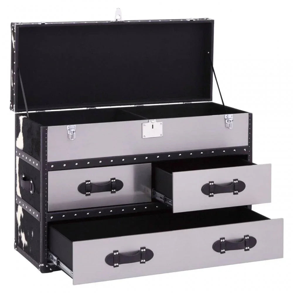 Grey storage trunk with cowhide sides and three drawers, lid open to show compartments
