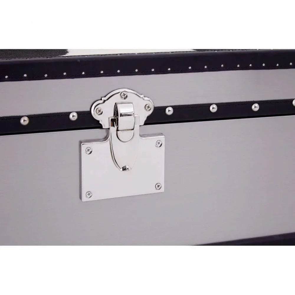 Closeup of metal storage chest latch with black trim and silver rivet detailing