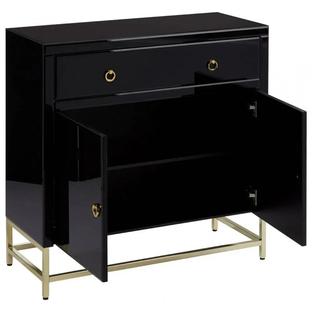 Black sideboard cabinet with gold handles and legs, open doors revealing interior storage