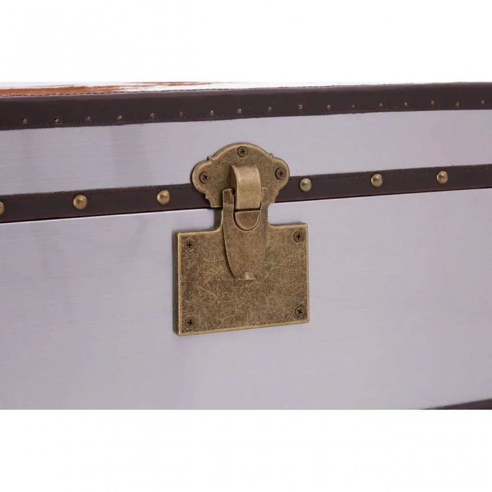 Closeup of wooden storage trunk with brass latch and metal trim detailing