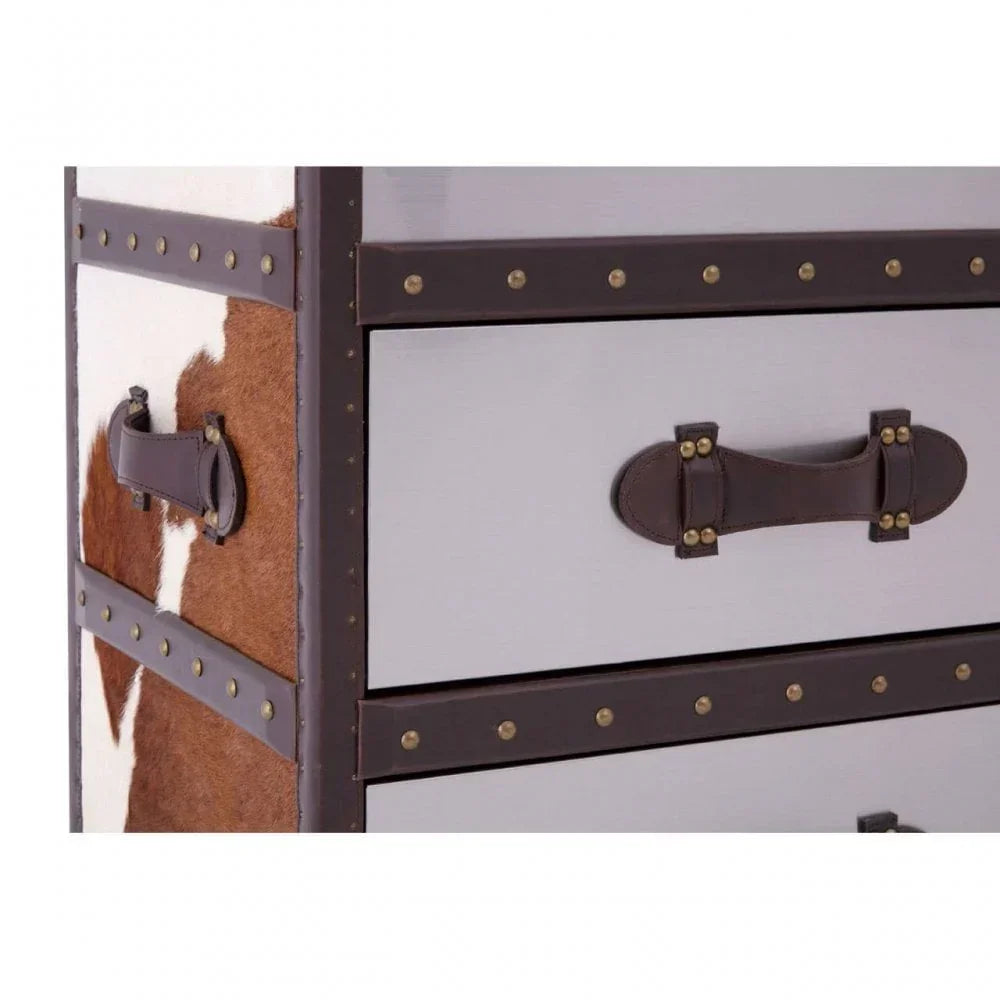 Chest of drawers with cowhide panel, brown leather trim and metal stud accents
