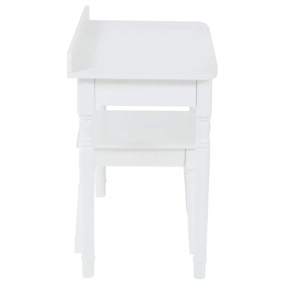 White wooden console table with turned legs and raised back panel, side view
