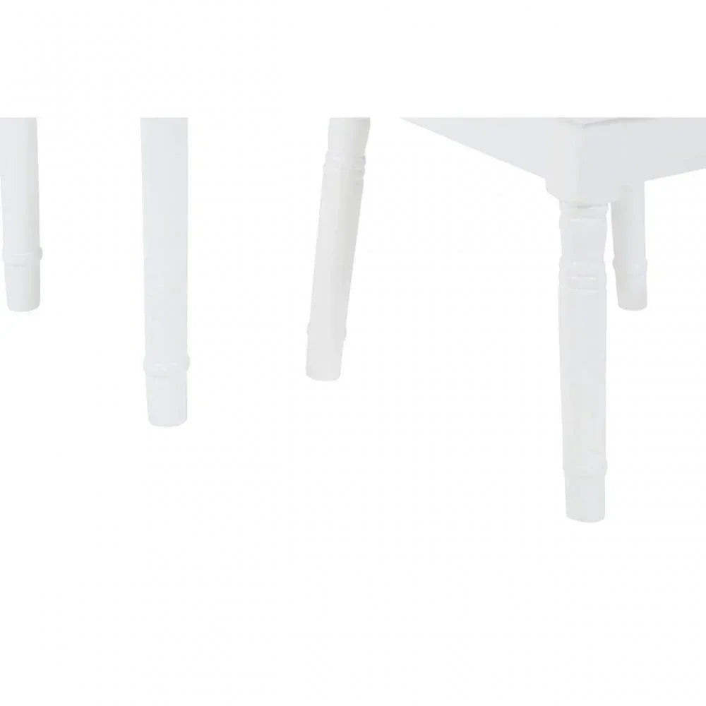 White wooden furniture legs with turned design, close-up view