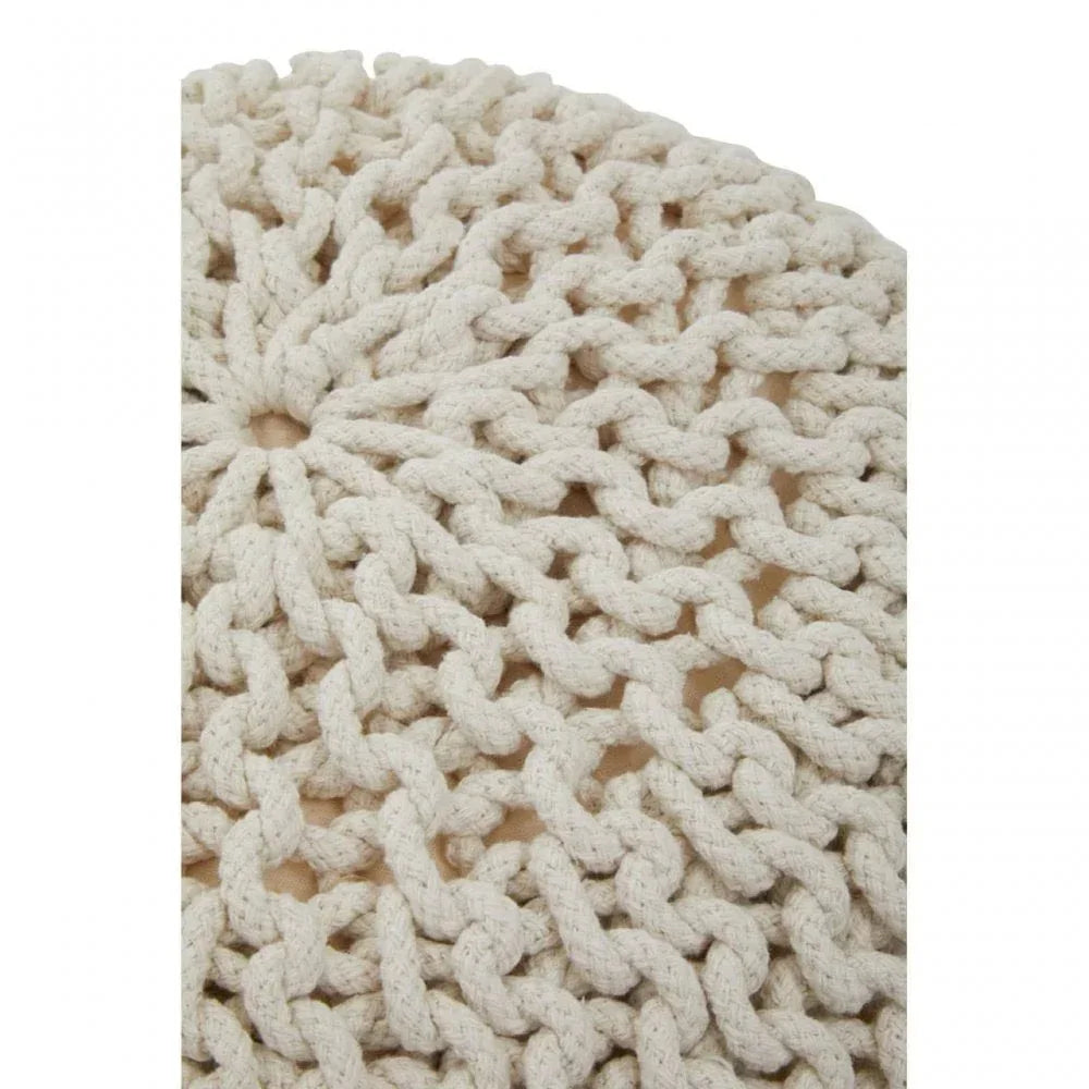Close-up of cream knitted pouffe with chunky cotton rope texture