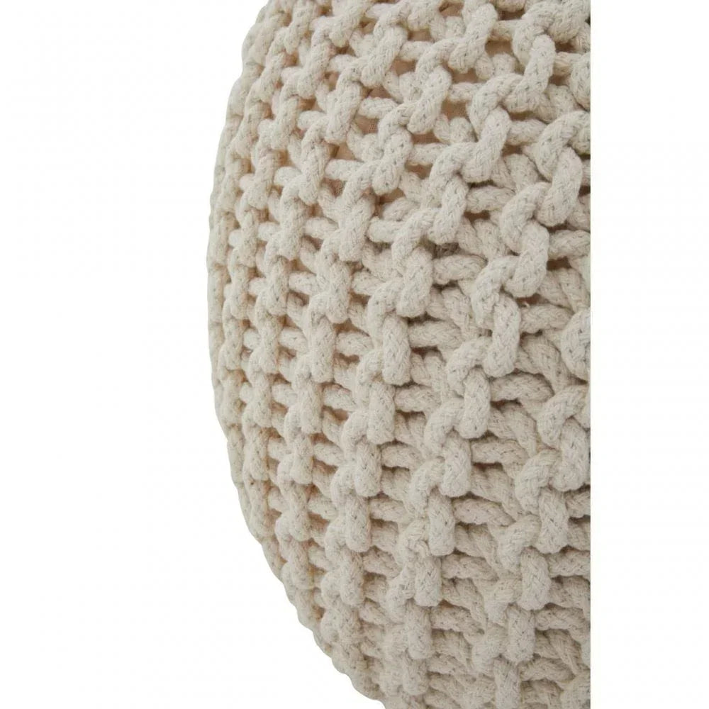 Close-up of cream knitted pouffe texture with chunky woven cotton detail