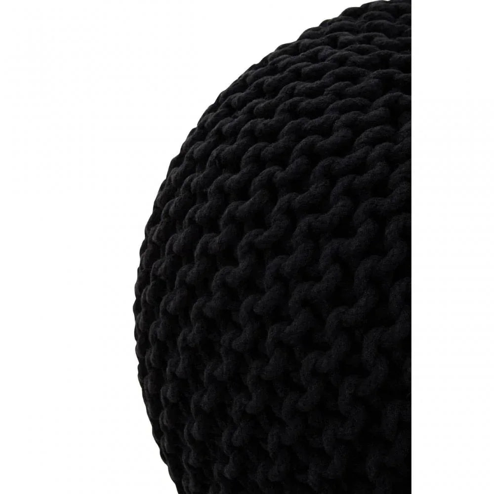 Close view of black knitted pouffe texture and chunky knit detailing