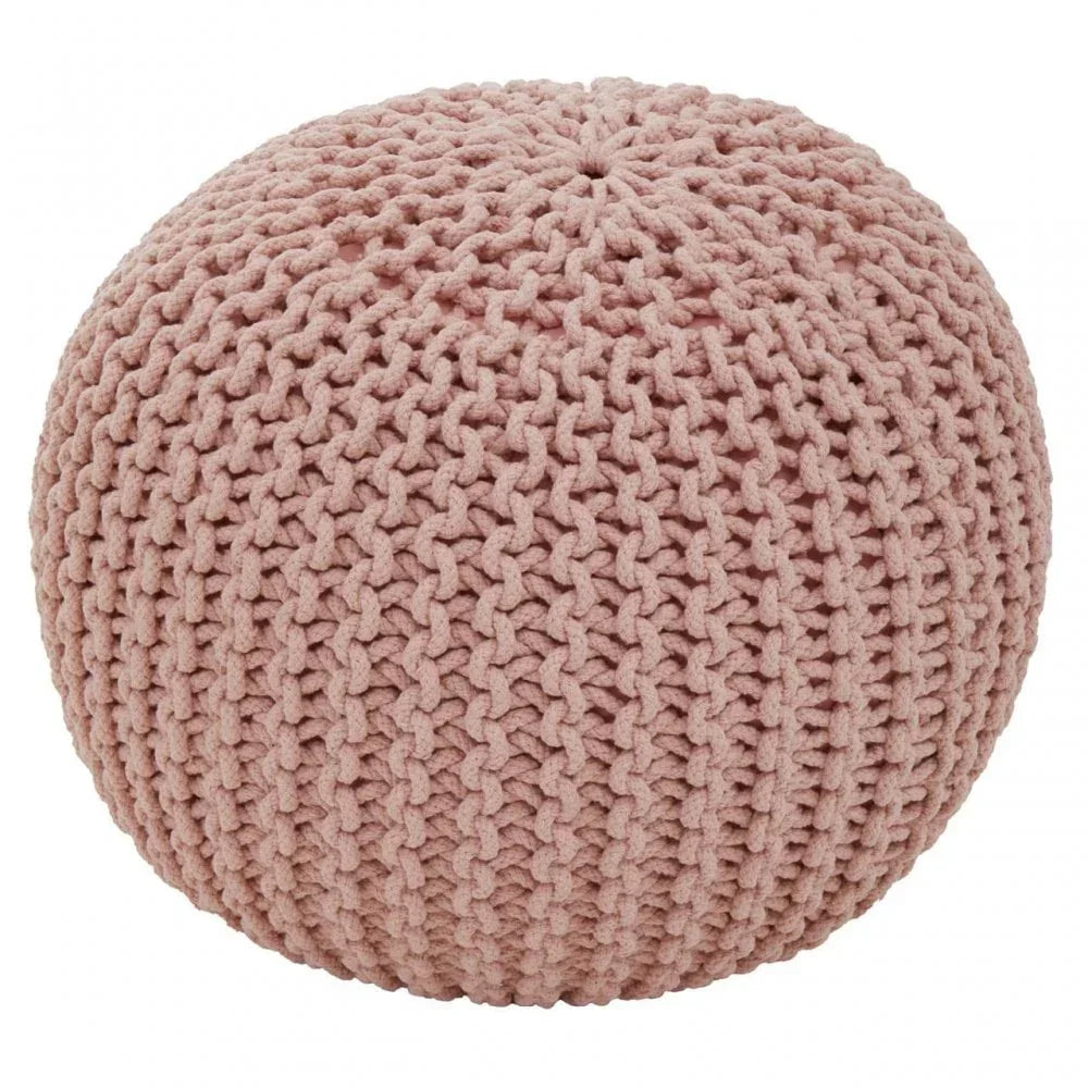 Round pink knitted pouffe with textured pattern, soft seating furniture for home interiors
