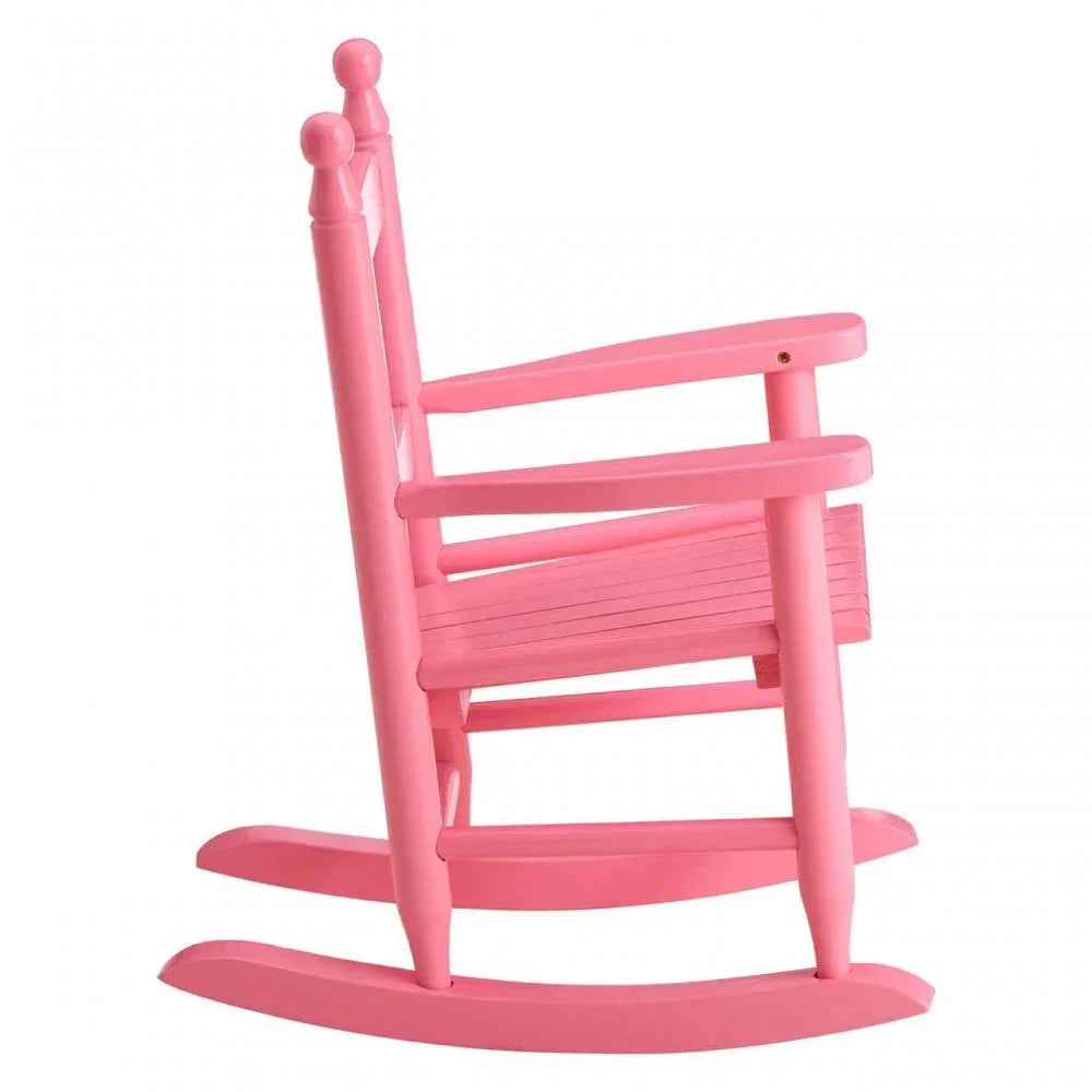 Pink wooden rocking chair side view with slatted seat and armrests