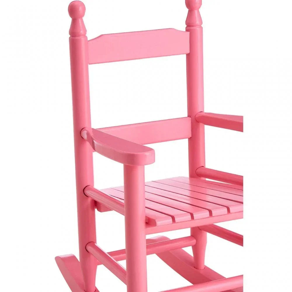 Pink wooden rocking chair with slatted seat and armrests, angled side view