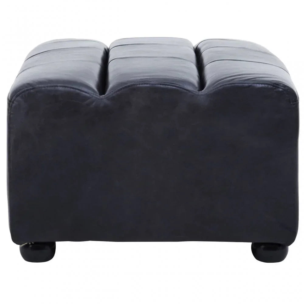 Black leather ottoman with tufted top and round feet, front angle view