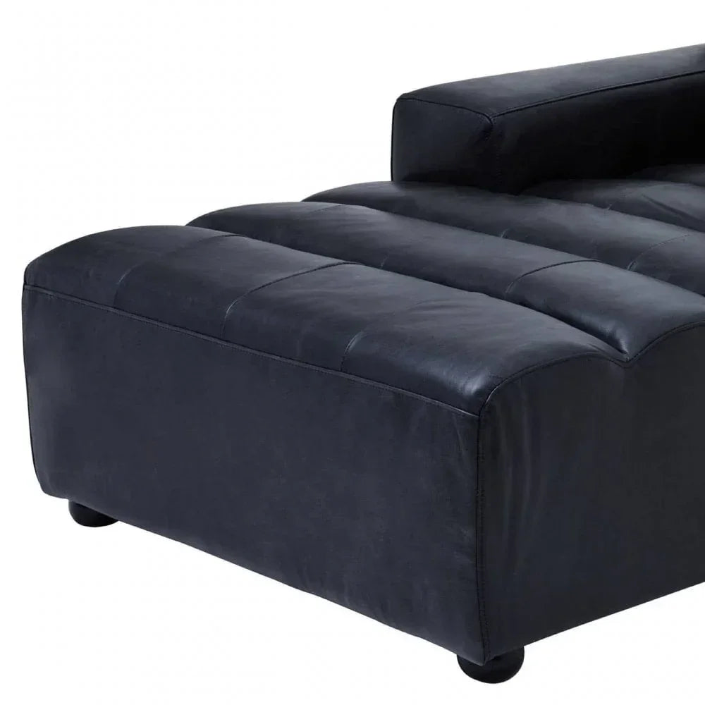 Black leather sofa chaise end with stitched seat detail and block armrest