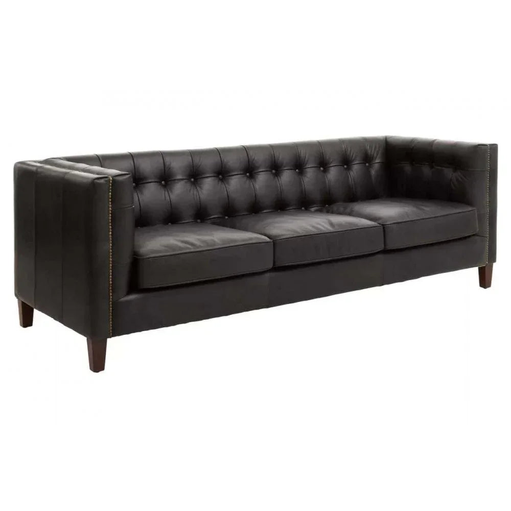 Black leather sofa with tufted backrest, three seat cushions and wooden legs