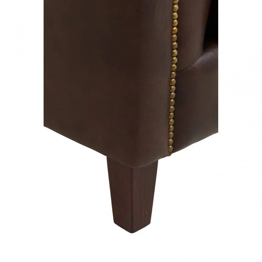 Brown leather sofa corner with wooden leg and brass stud detailing