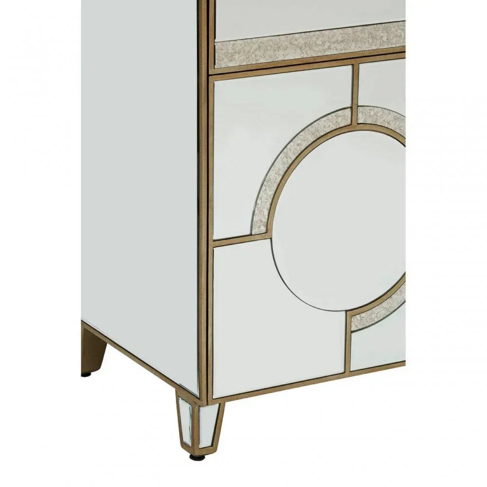 Mirrored cabinet corner with gold trim and geometric circle design on white panel