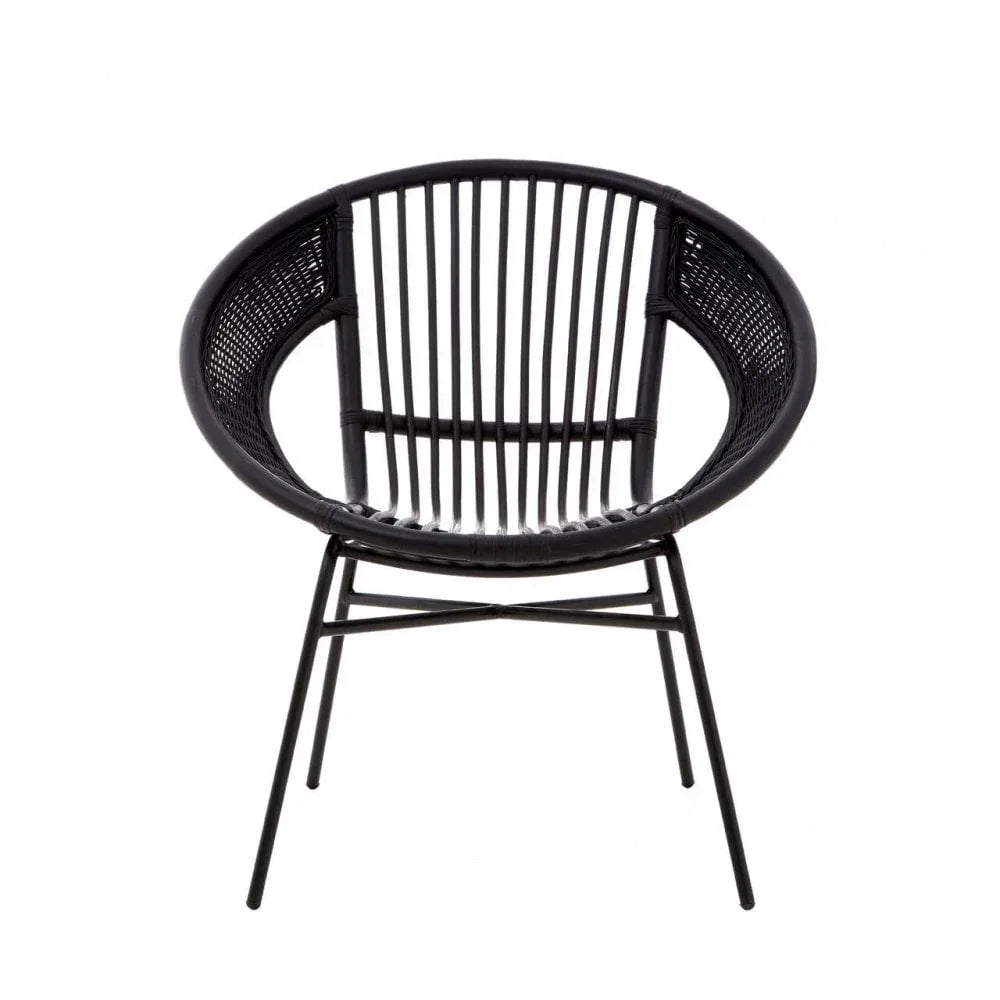 Black rattan accent chair with round seat and metal legs, front view