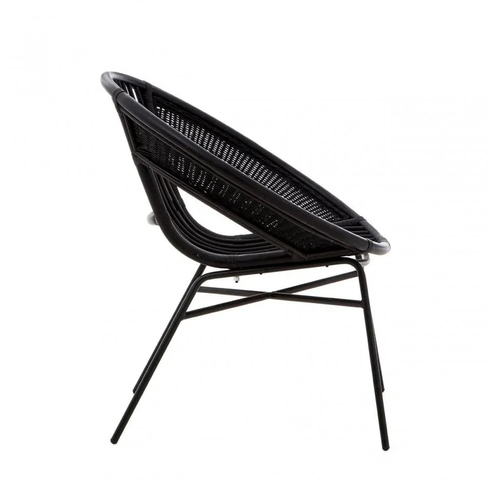 Black rattan accent chair with metal legs, side profile view