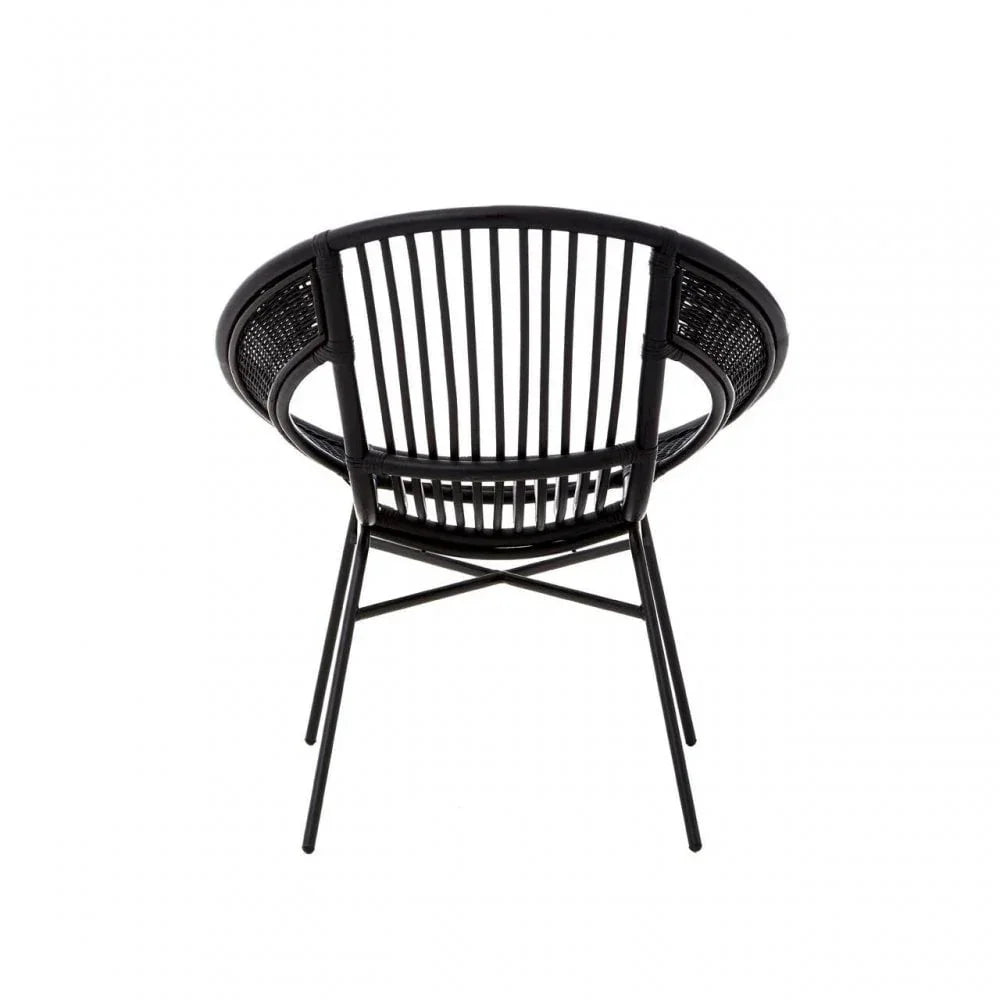 Black rattan dining chair with rounded backrest and vertical slats, rear view