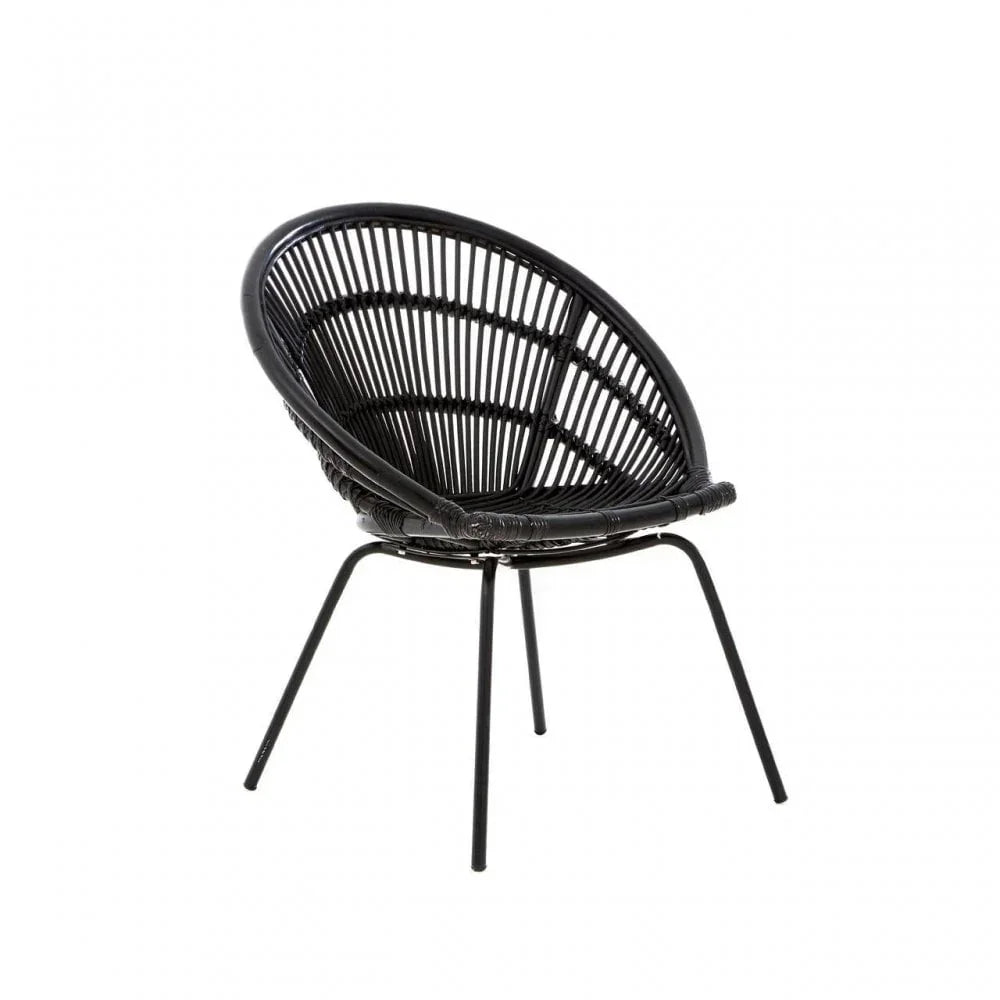 Black rattan accent chair with round seat and metal legs against white background