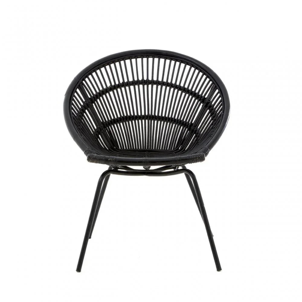Black rattan accent chair with circular backrest and metal legs, front view