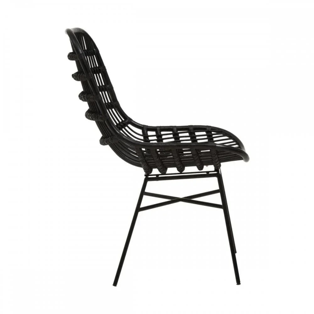 Black rattan dining chair with open weave seat and metal legs, side view