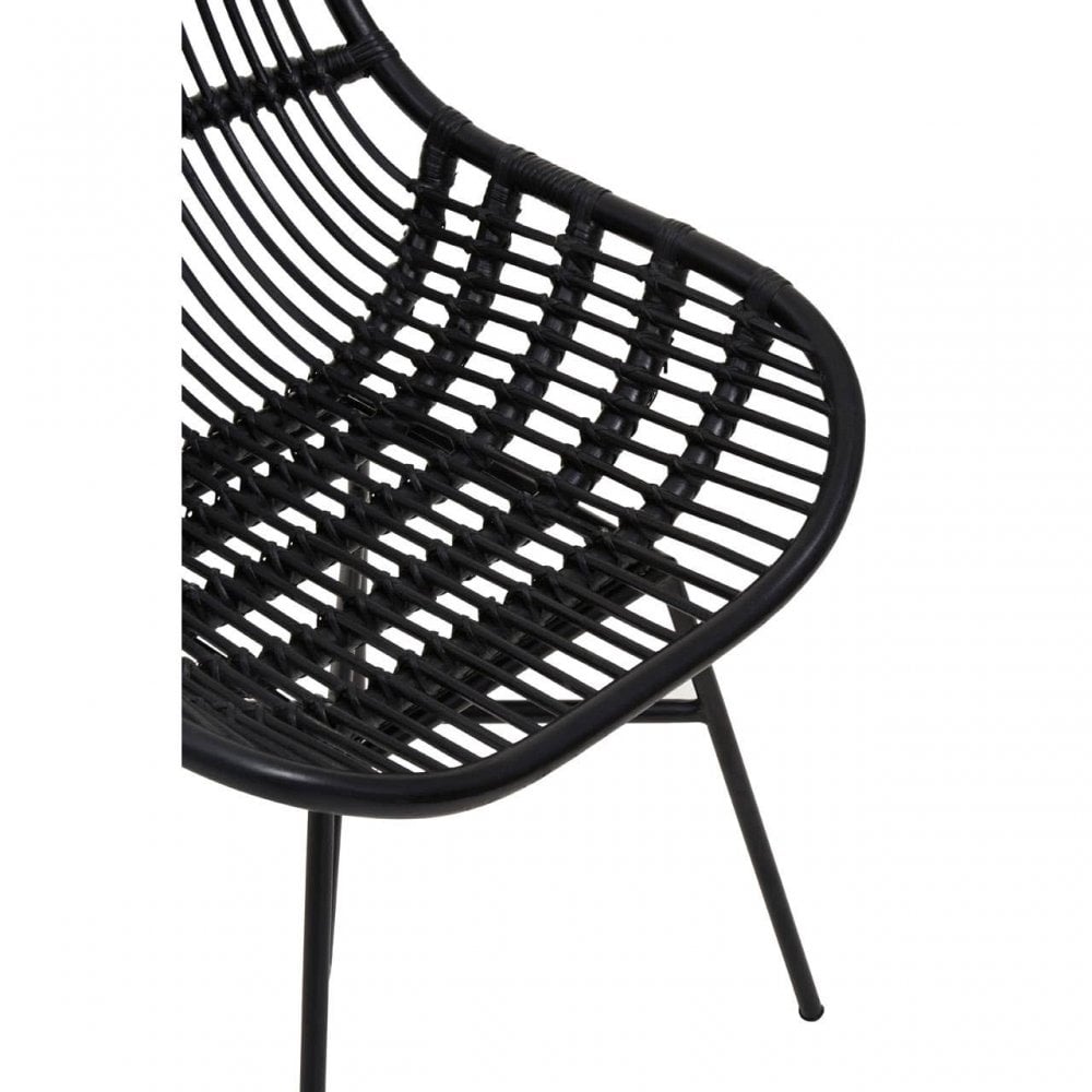 Black rattan dining chair with curved seat and metal legs, close-up of seat detail