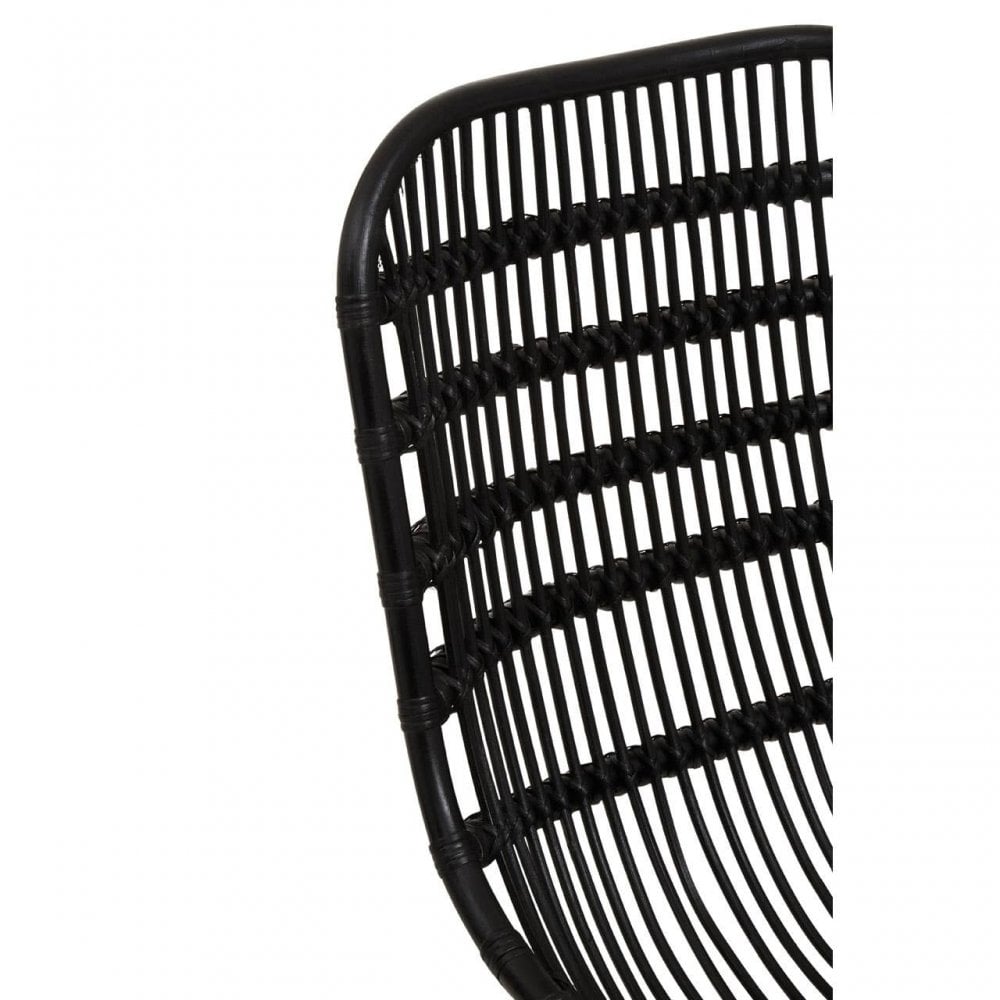 Close up of black rattan chair backrest with woven detail