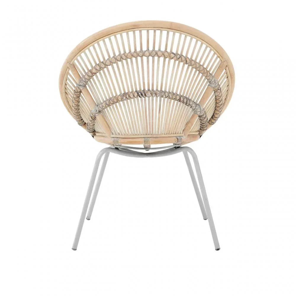 Round rattan accent chair with woven back and metal legs, rear view