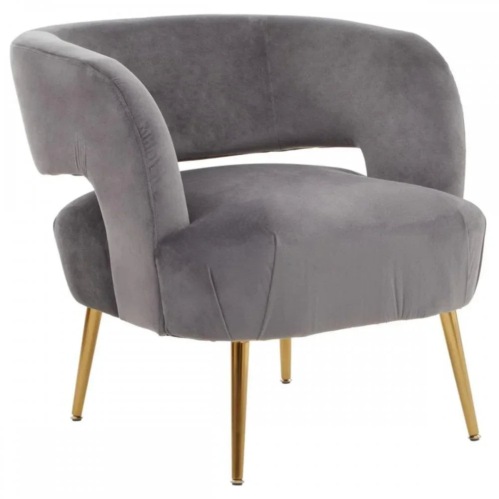 Grey velvet accent chair with curved backrest and gold metal legs