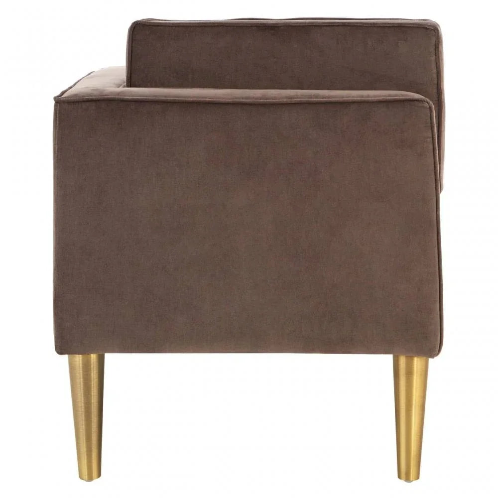 Brown velvet armchair with gold metal legs, viewed from the side