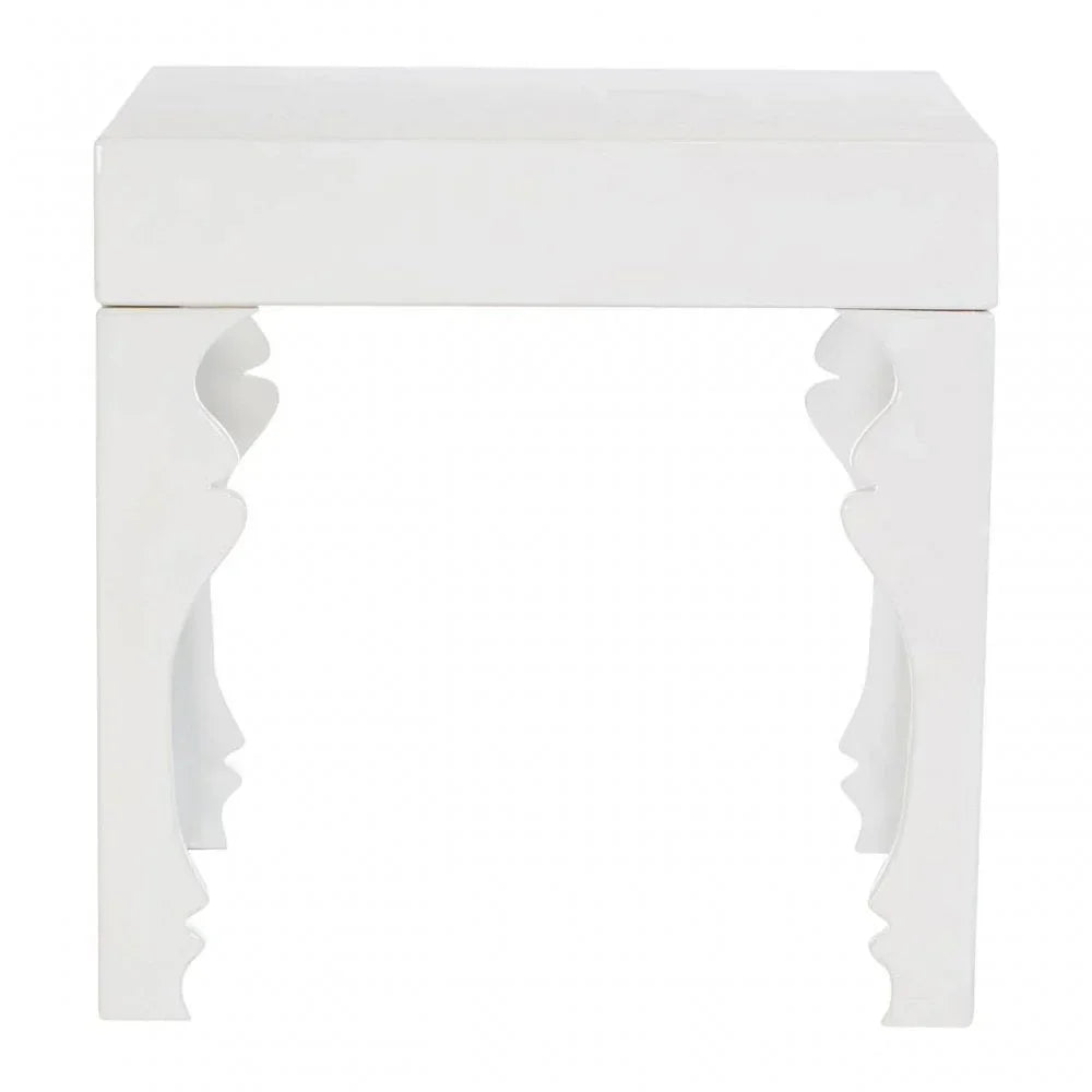 White wooden side table with sculpted profile leg detail, front view