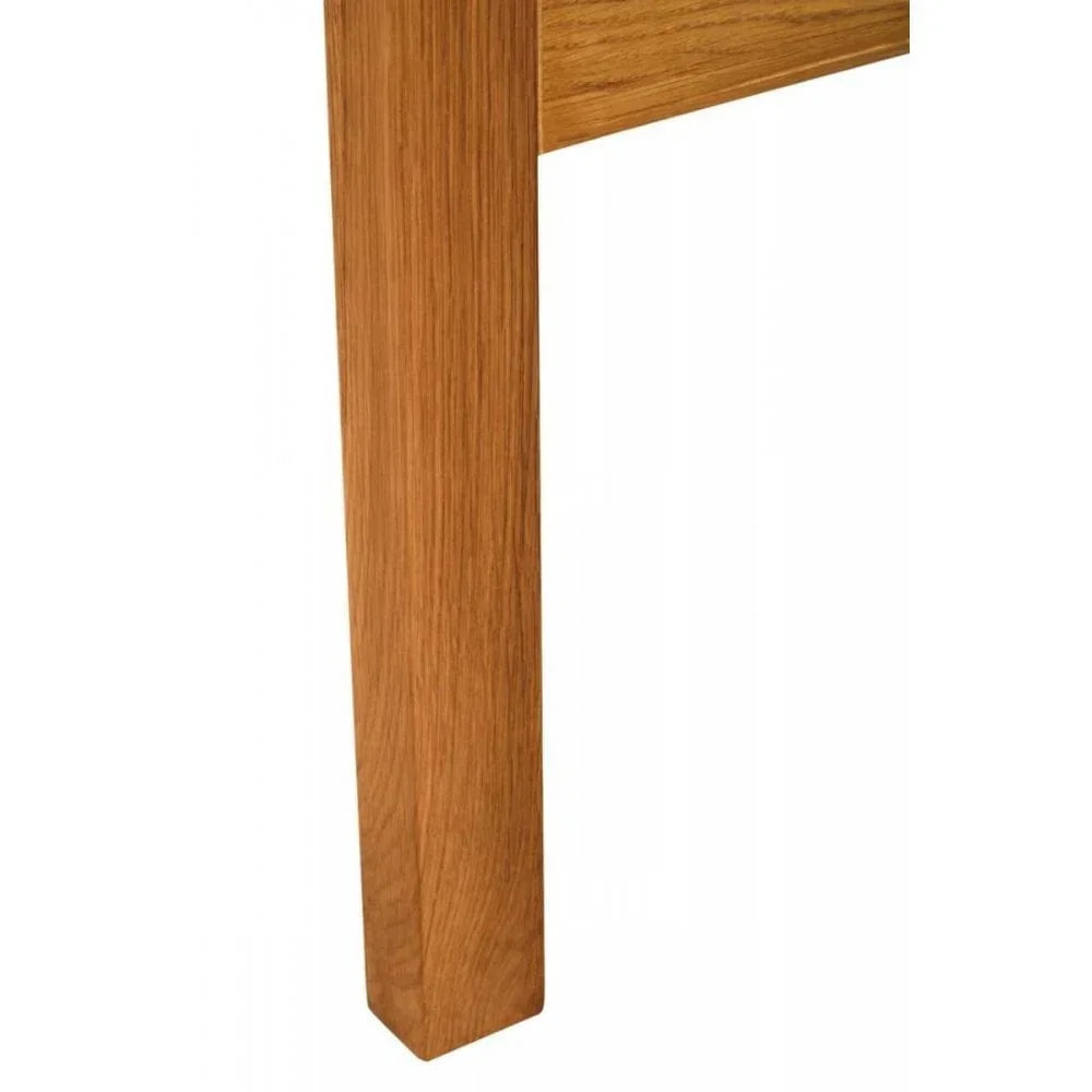 Close-up of oak dining table leg showing natural wood grain