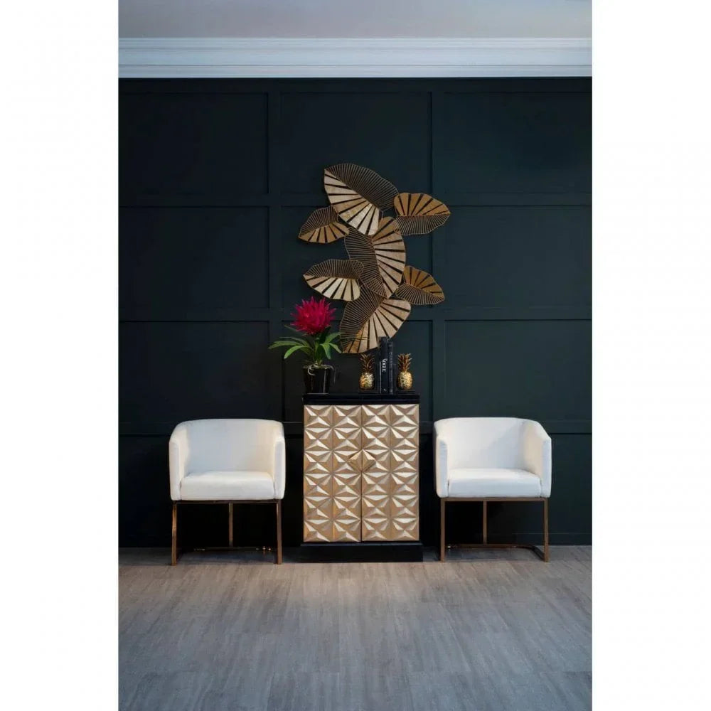 Modern armchairs and geometric sideboard with gold wall art and decorative vase