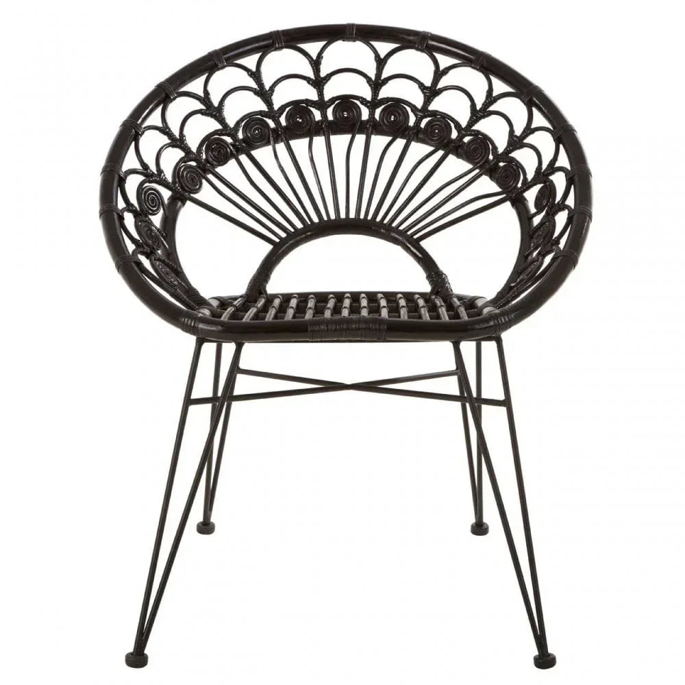 Black rattan accent chair with round backrest and metal legs, front view