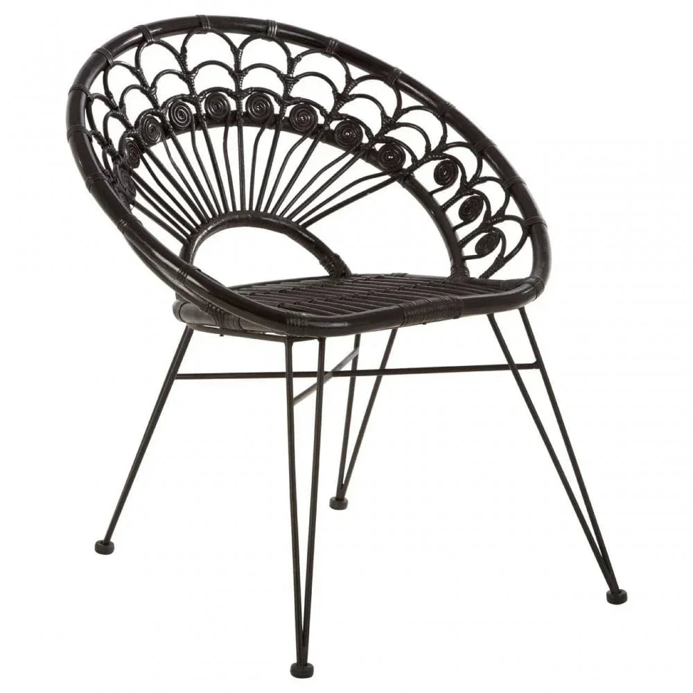 Black rattan chair with round seat and decorative woven backrest on metal legs