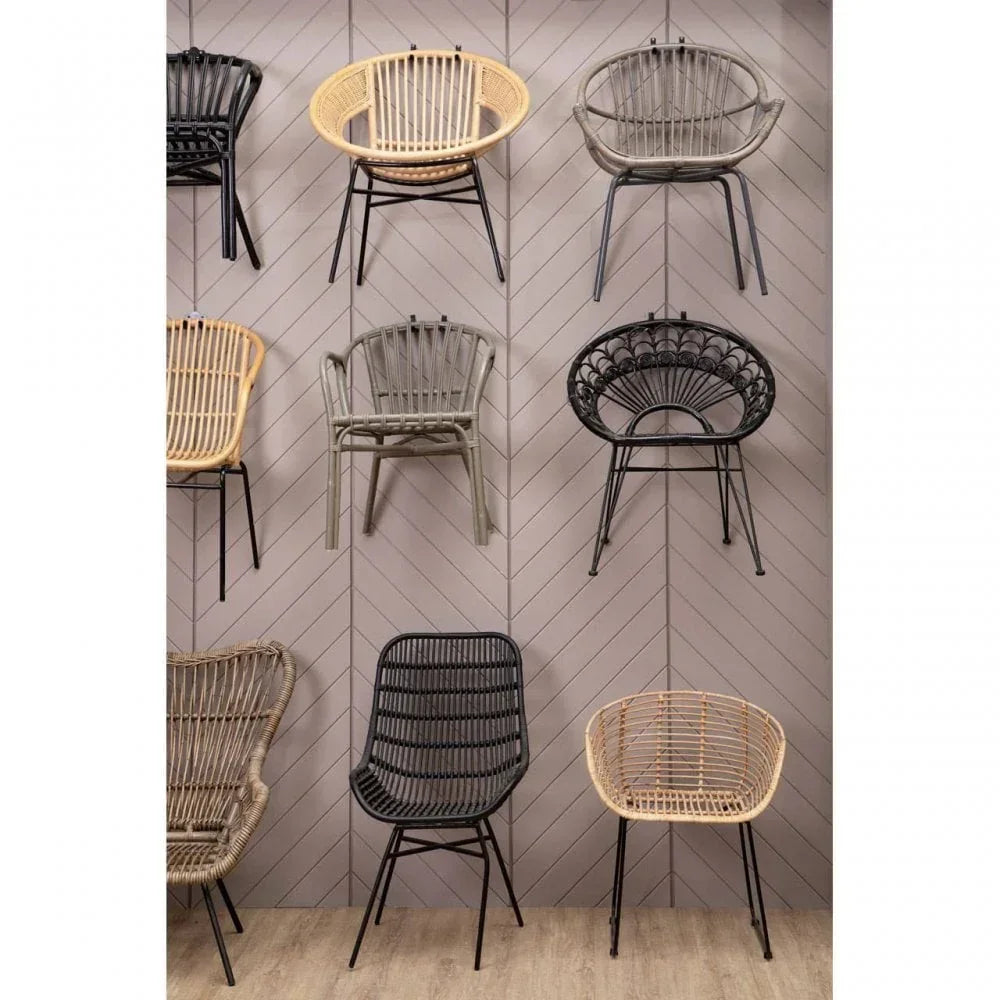 Rattan dining chairs in assorted colors and styles displayed on wall and floor