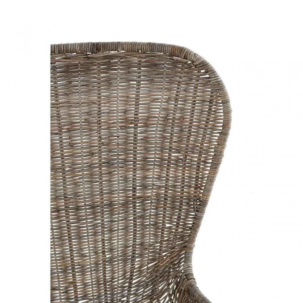Closeup of wicker chair backrest in natural brown finish