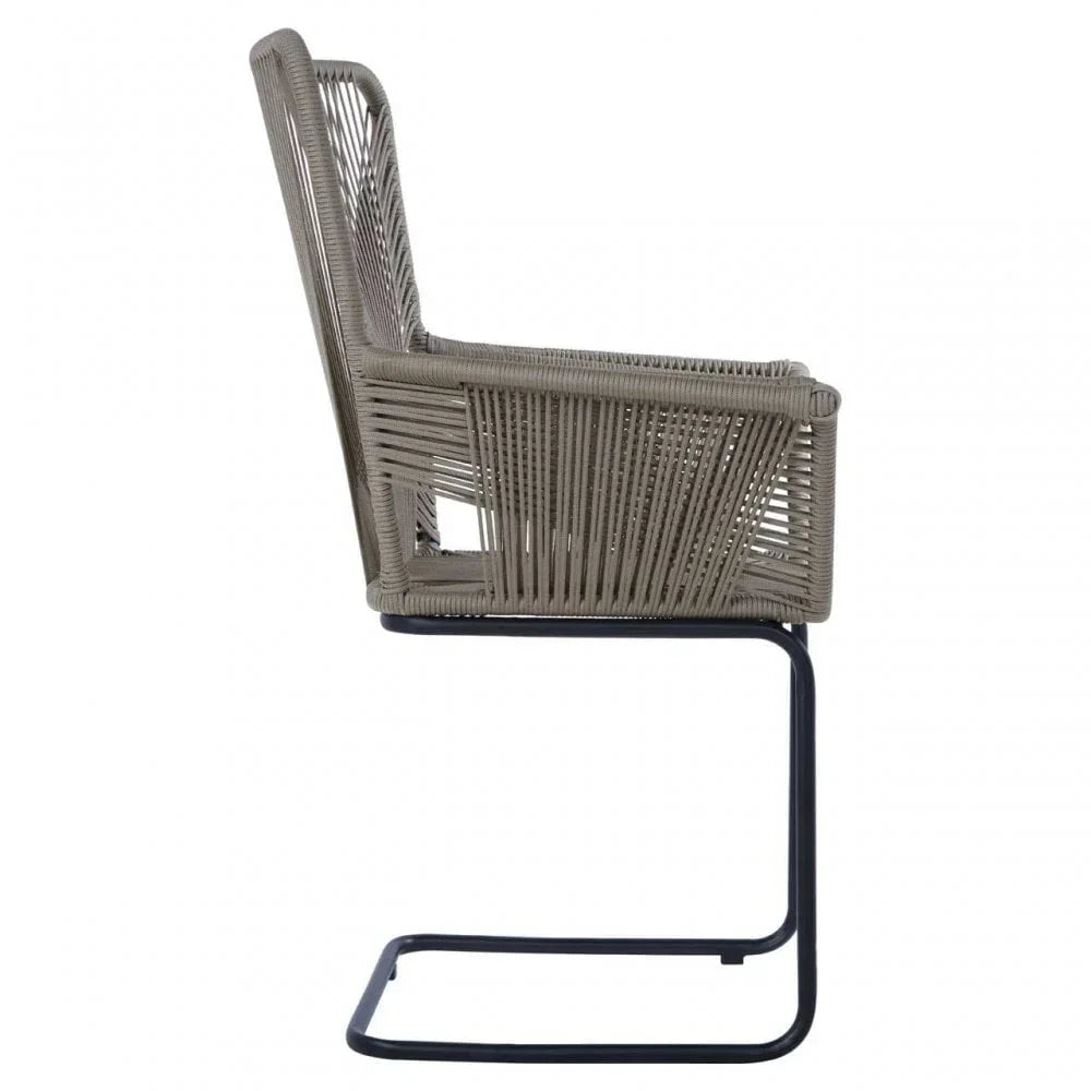 Side view of rattan dining chair with metal cantilever frame and woven backrest