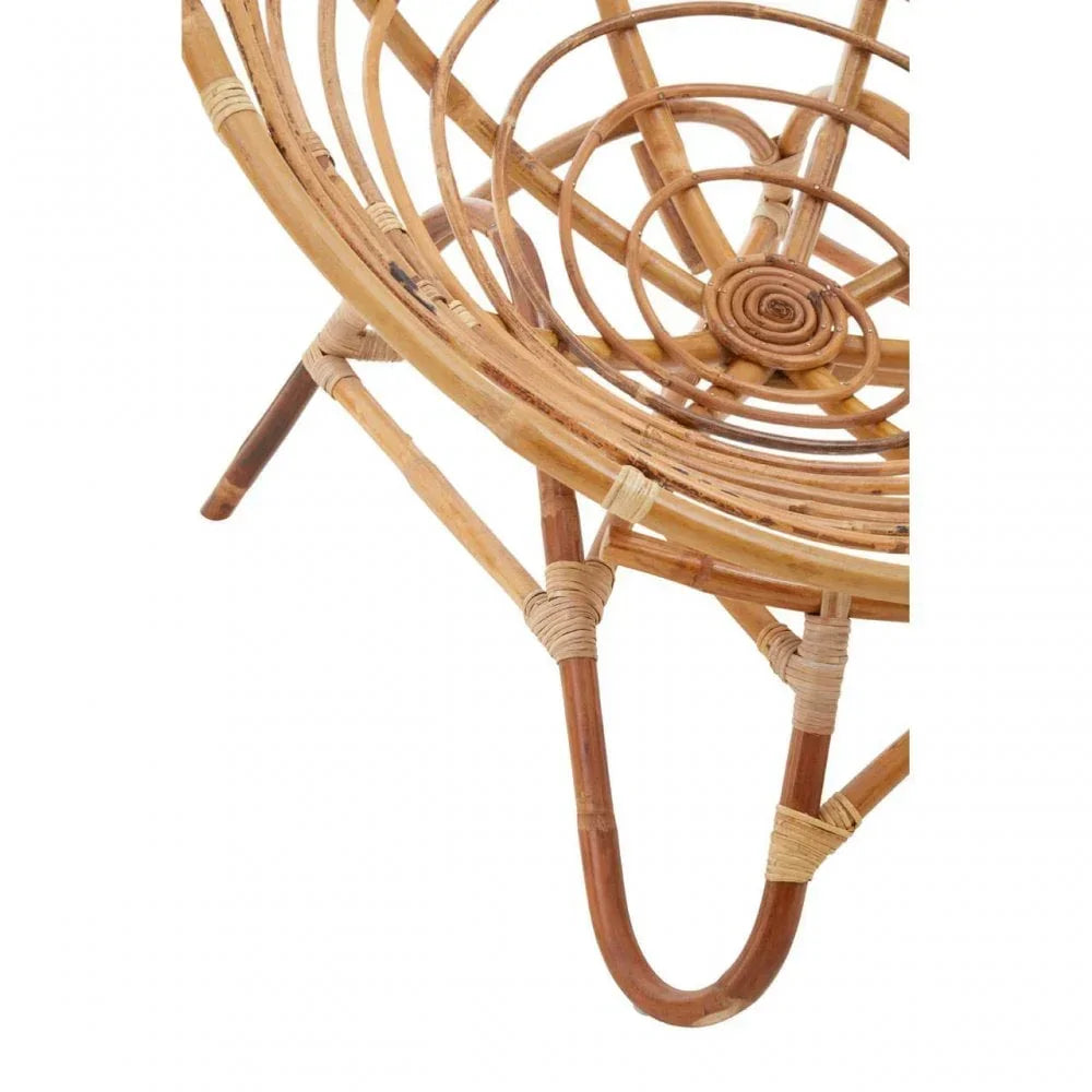Close up of natural rattan chair seat and legs with woven detail