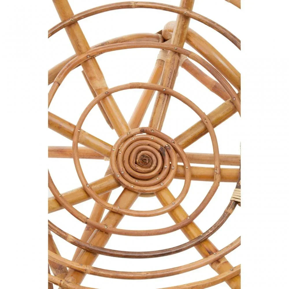 Close-up of natural rattan chair back with spiral and circular woven patterns