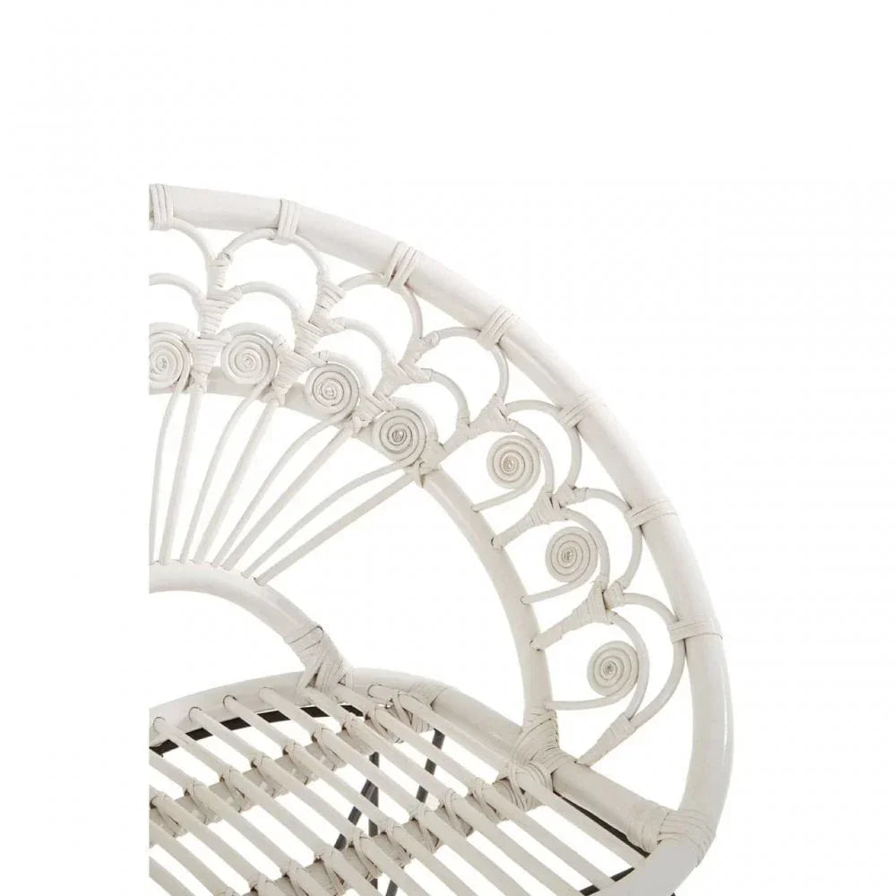 White rattan chair with decorative curved backrest and woven seat detail