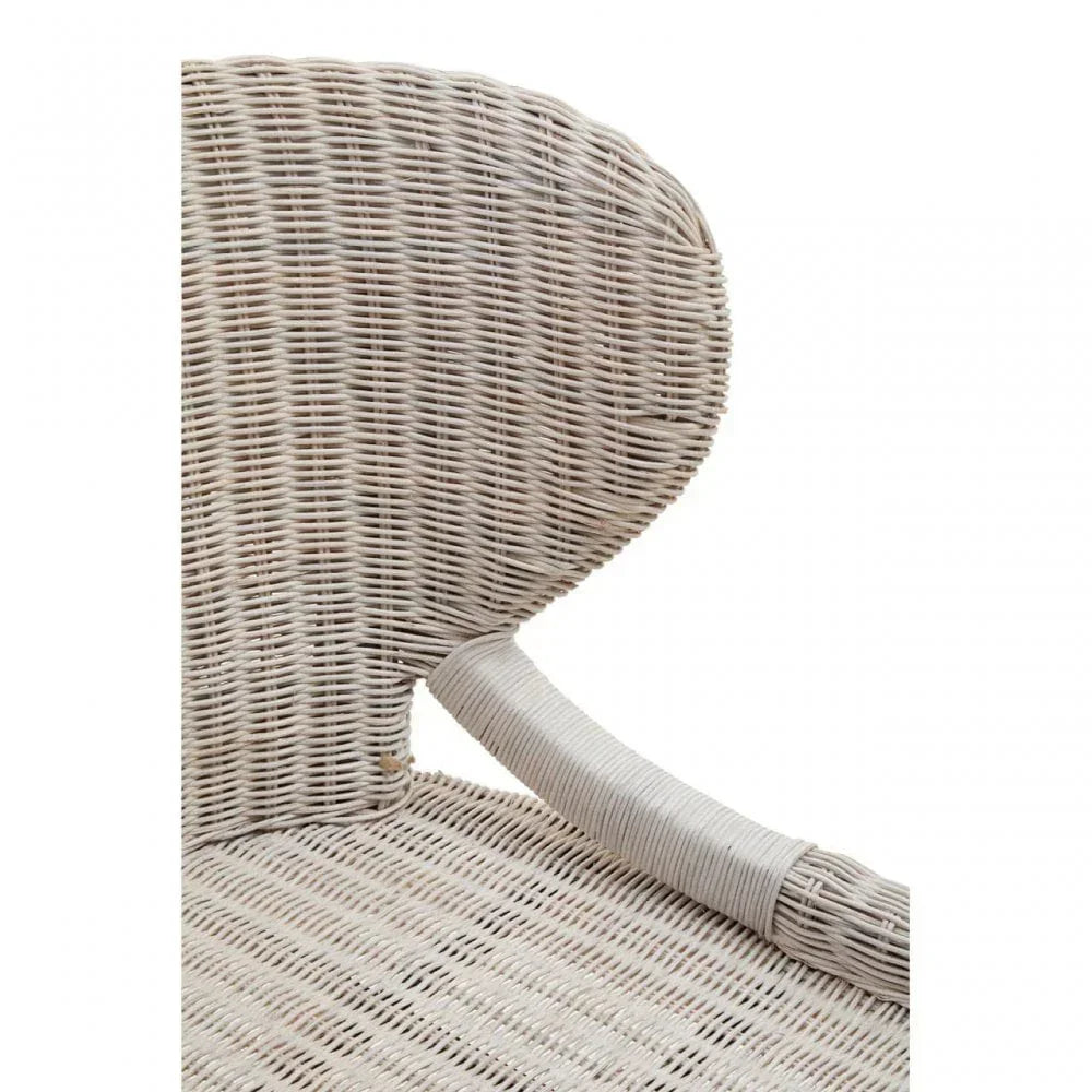 Close up of natural rattan chair backrest and seat with curved woven detail