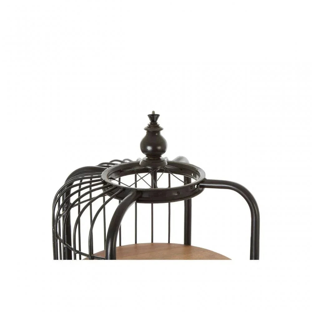 Black metal birdcage shelf with wooden base and decorative finial detail