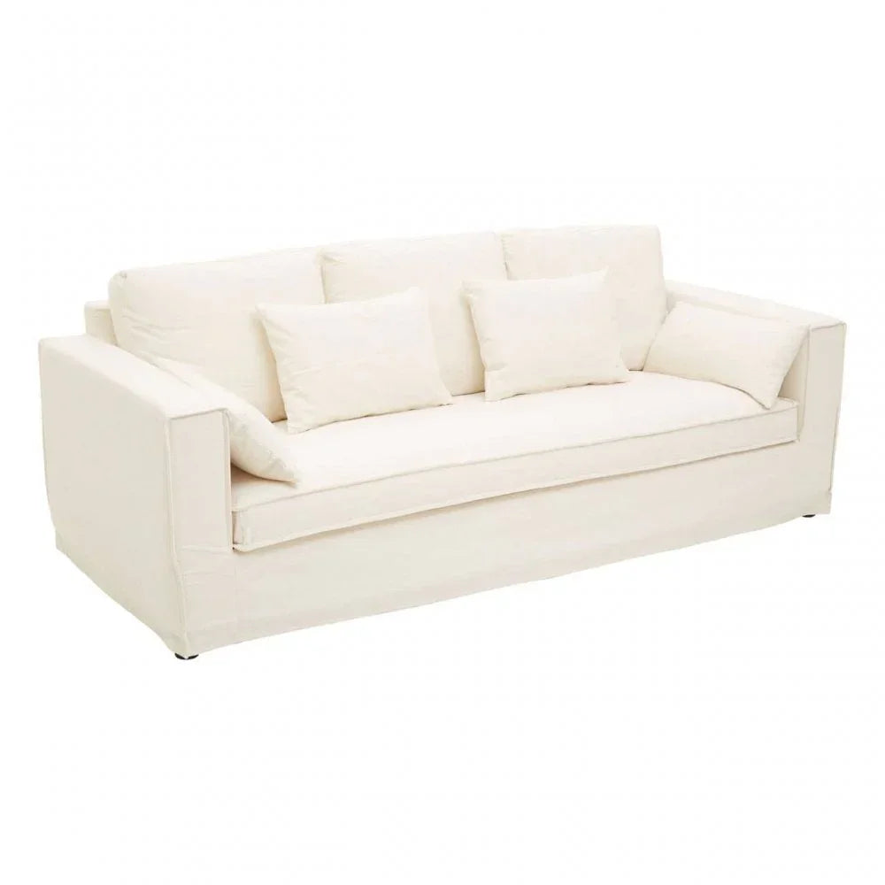 Cream fabric sofa with five matching cushions and square arms on white background