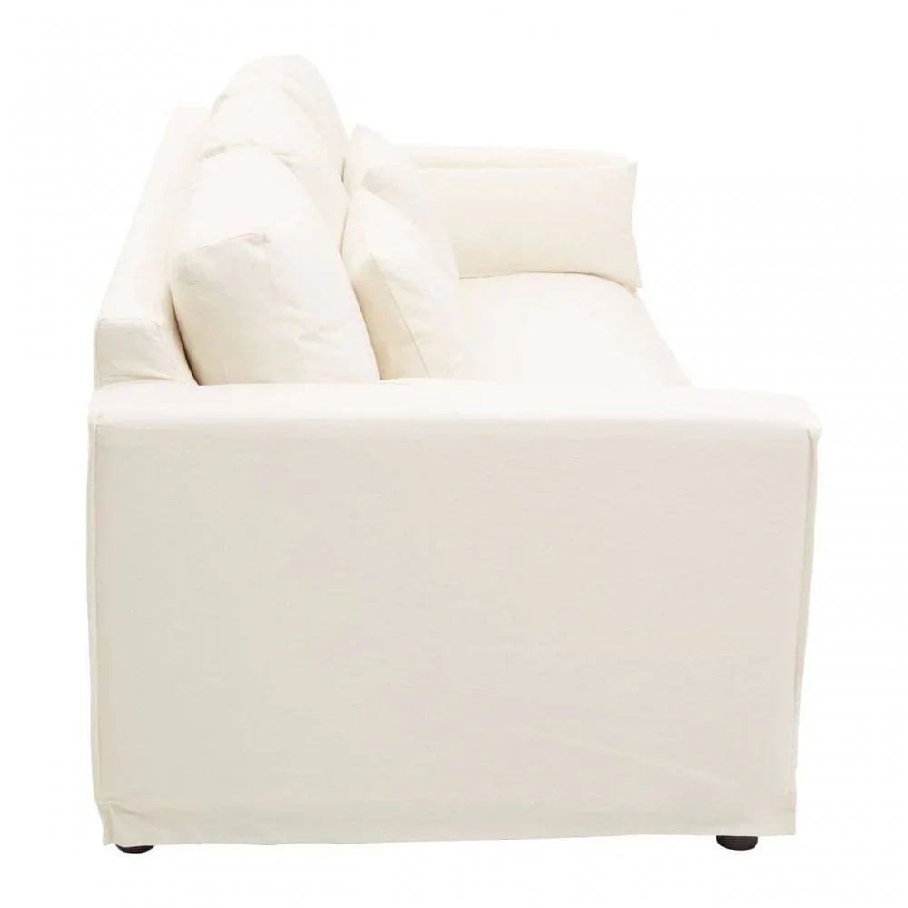 Side view of ivory fabric sofa with plush cushions and low arms