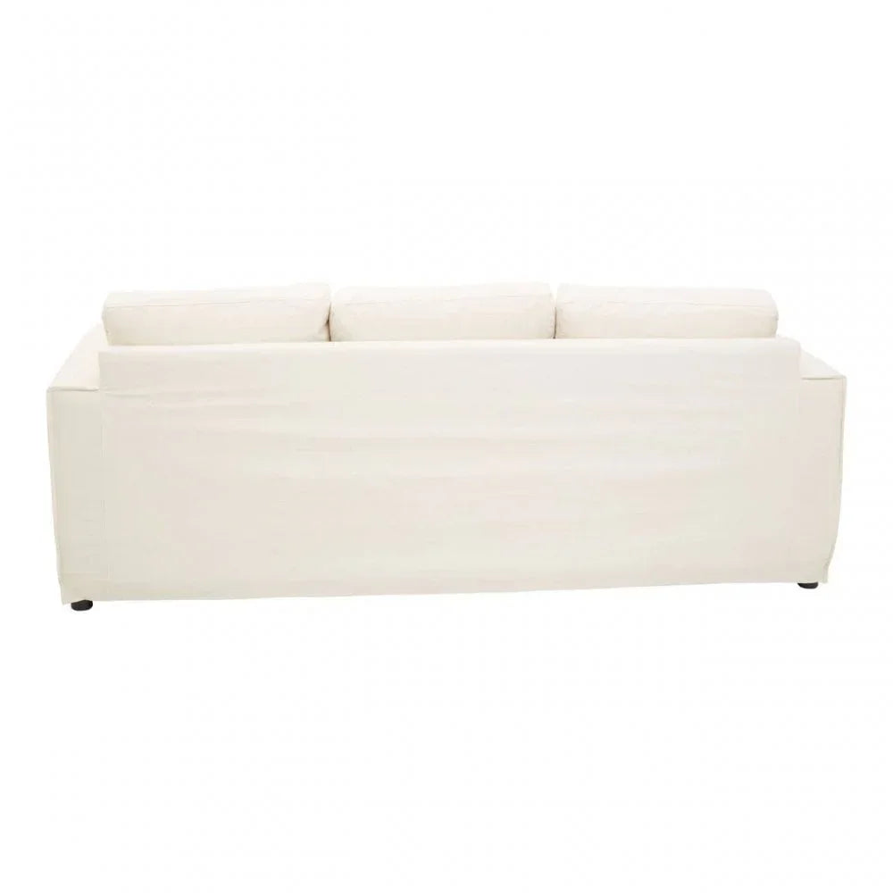 Rear view of cream fabric sofa with clean lines and three back cushions