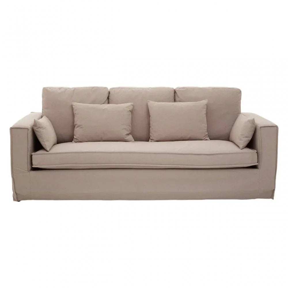Beige fabric sofa with five matching cushions and wide armrests on white background