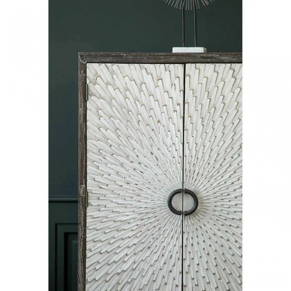 White textured wooden cabinet with sunburst pattern and round metal handles